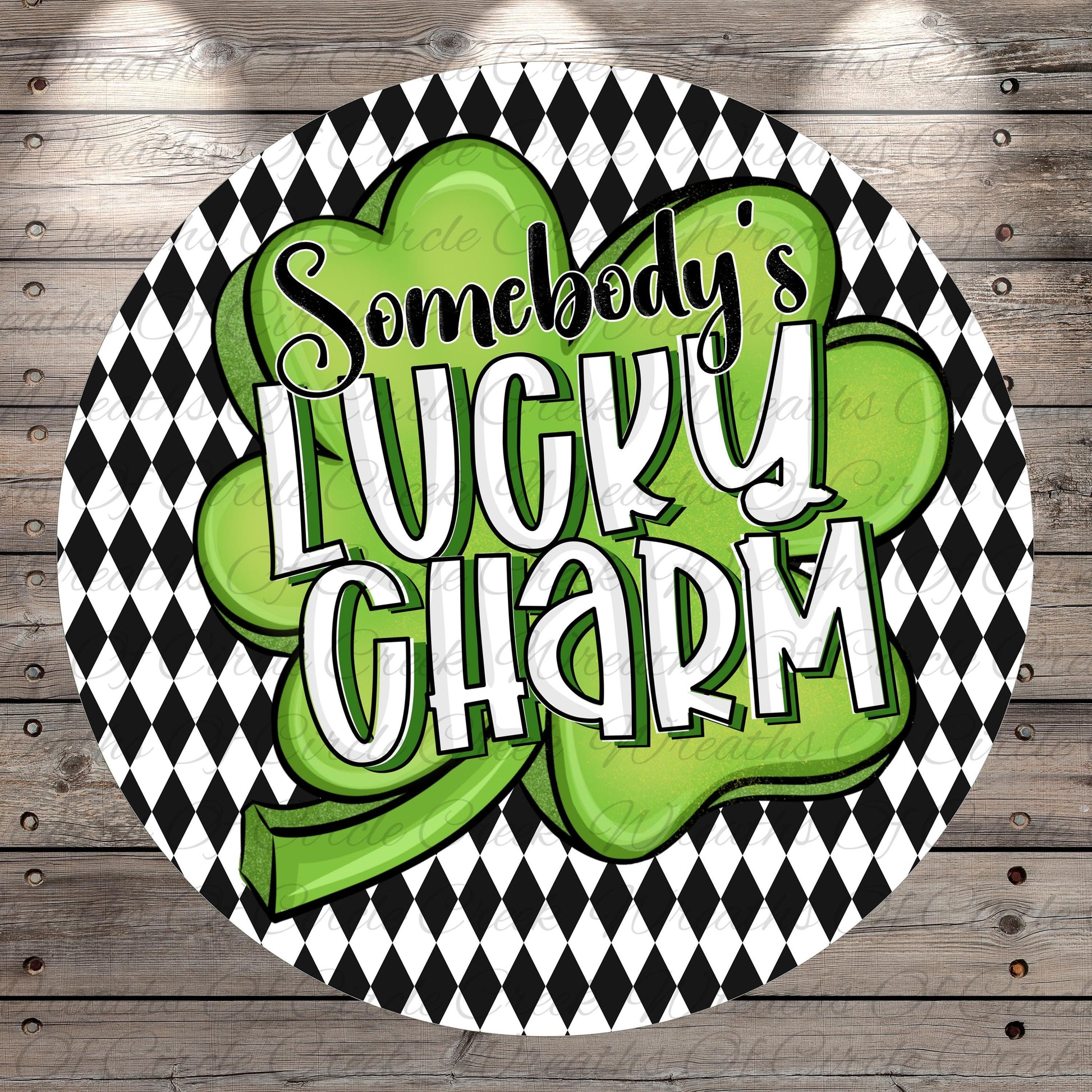 a circular design with a black and white checkered pattern and a green clover-shaped symbol. The text "SOMEBODY'S LUCKY CHARM" is prominently displayed in the center of the design.