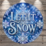 A circular sign with the text "LET IT SNOW" against a background of sparkling snowflakes and a dark blue color.