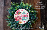 a wreath with a cartoon goose wearing sunglasses and a bow, surrounded by green foliage. The wreath is described as a "Wreath Not Included" and "Purpose Only" decoration, and it is part of the "Wreaths of Circle Creek" collection.