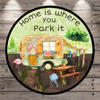 a sign that says home is where you park it
