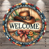 A decorative welcome sign featuring a cowboy hat, a wooden sign, and colorful floral elements.