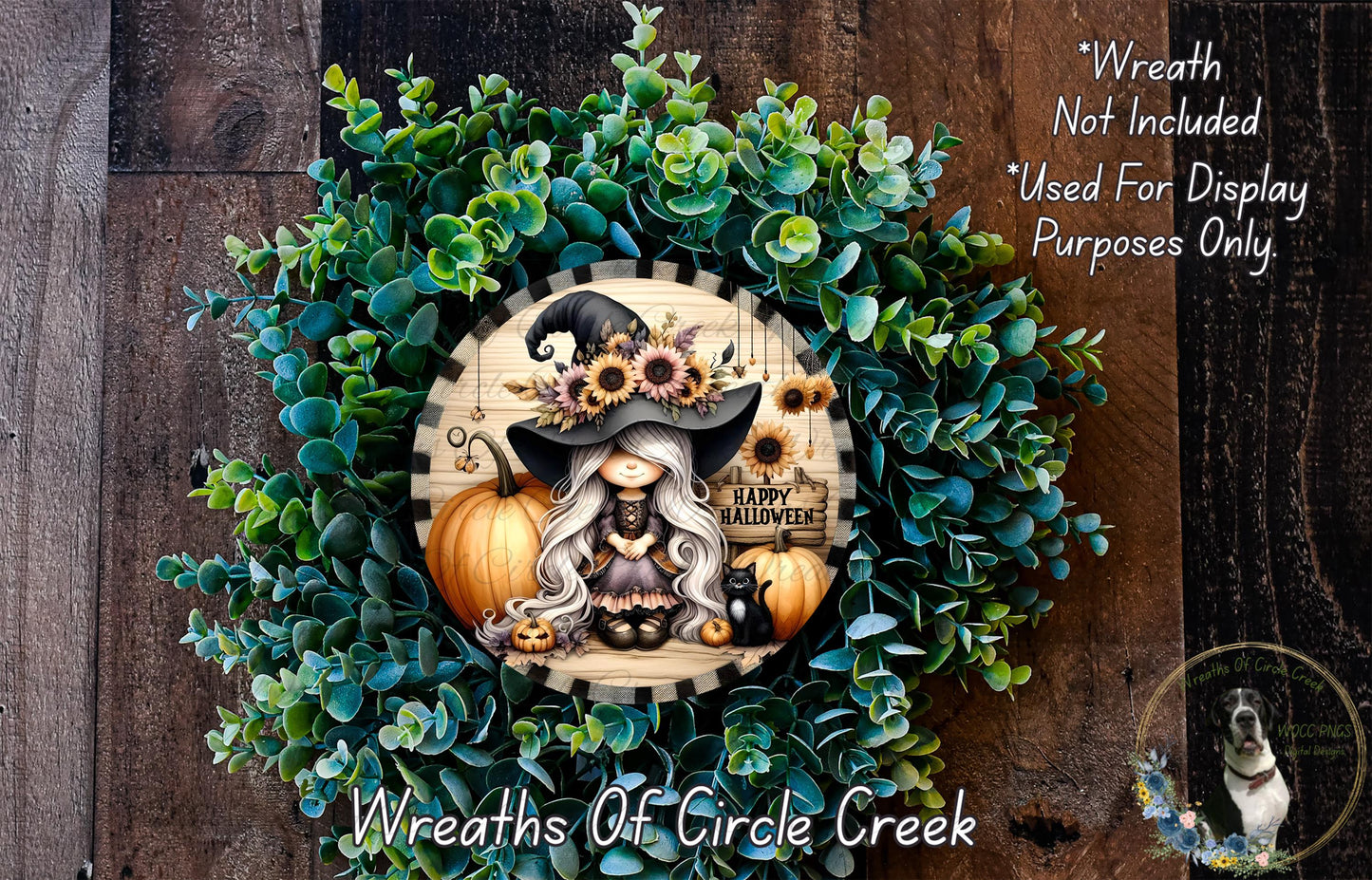 A wreath featuring a cartoon illustration of a witch surrounded by pumpkins and flowers, with the text "Happy Halloween" on it.