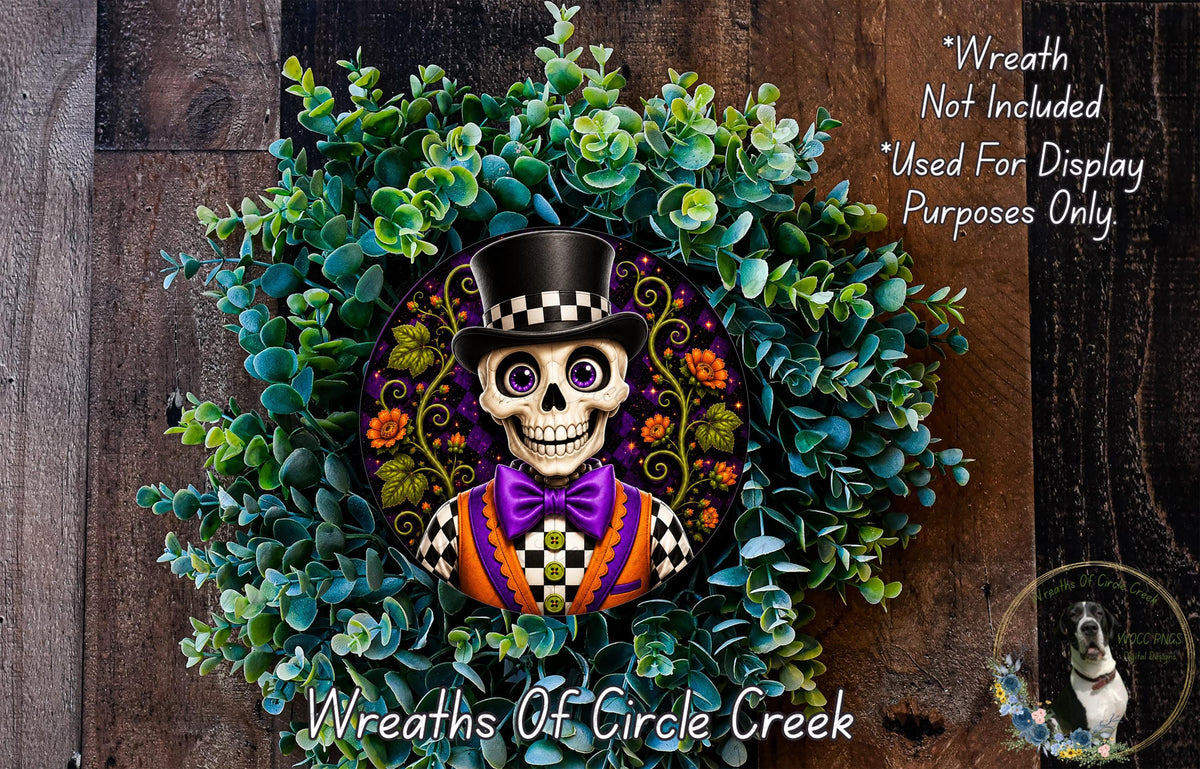 A wreath featuring a skeleton wearing a top hat and bow tie, surrounded by green foliage.