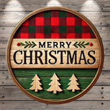 A circular wooden sign with the text "MERRY CHRISTMAS" in bold letters, surrounded by a plaid pattern and three wooden Christmas tree cutouts.