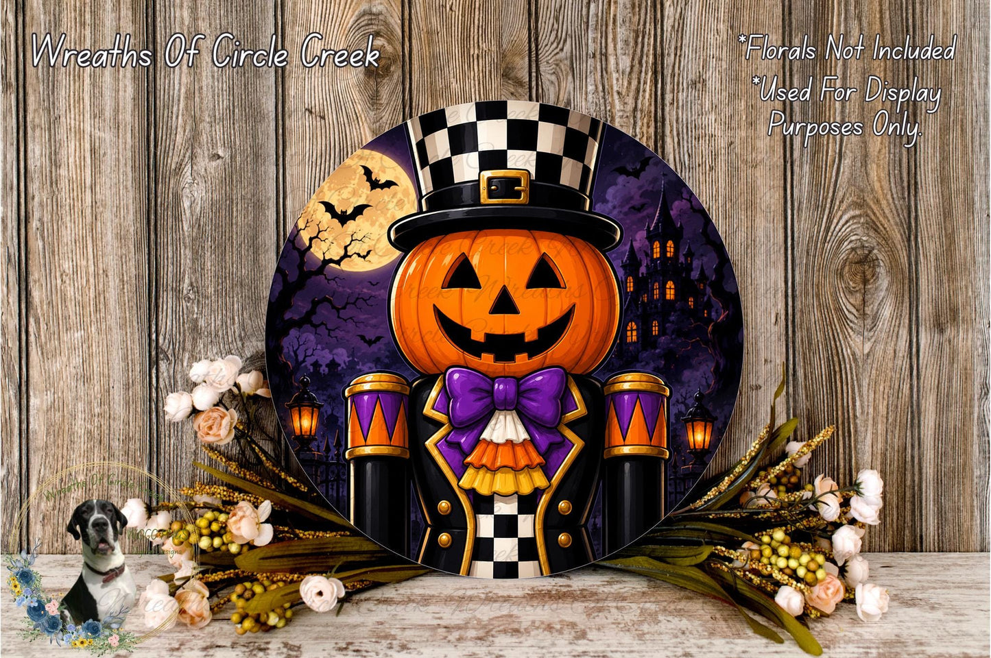 A Halloween-themed wreath featuring a jack-o-lantern wearing a top hat and bow tie, surrounded by flowers and a castle in the background.