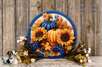 A decorative wreath with autumn foliage, sunflowers, and pumpkins, placed on a wooden surface.