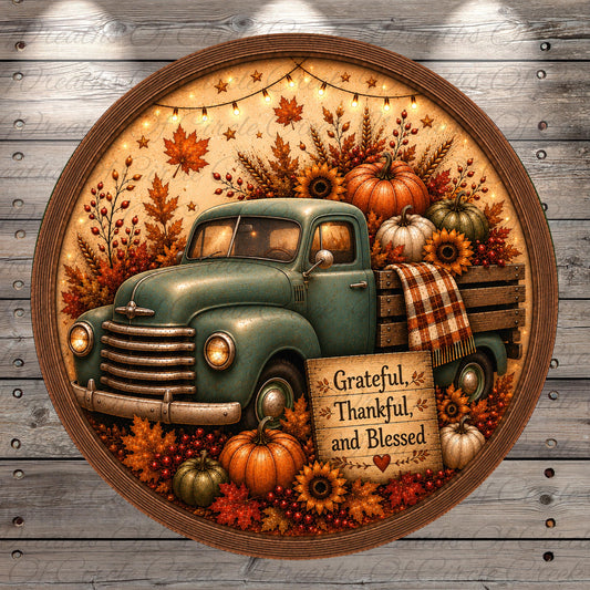 A vintage green truck is surrounded by autumn decorations, including pumpkins, sunflowers, and leaves, with a sign that says "Grateful, Thankful, and Blessed".