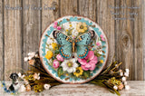 A decorative plate featuring a colorful butterfly surrounded by a floral arrangement, placed on a wooden surface.