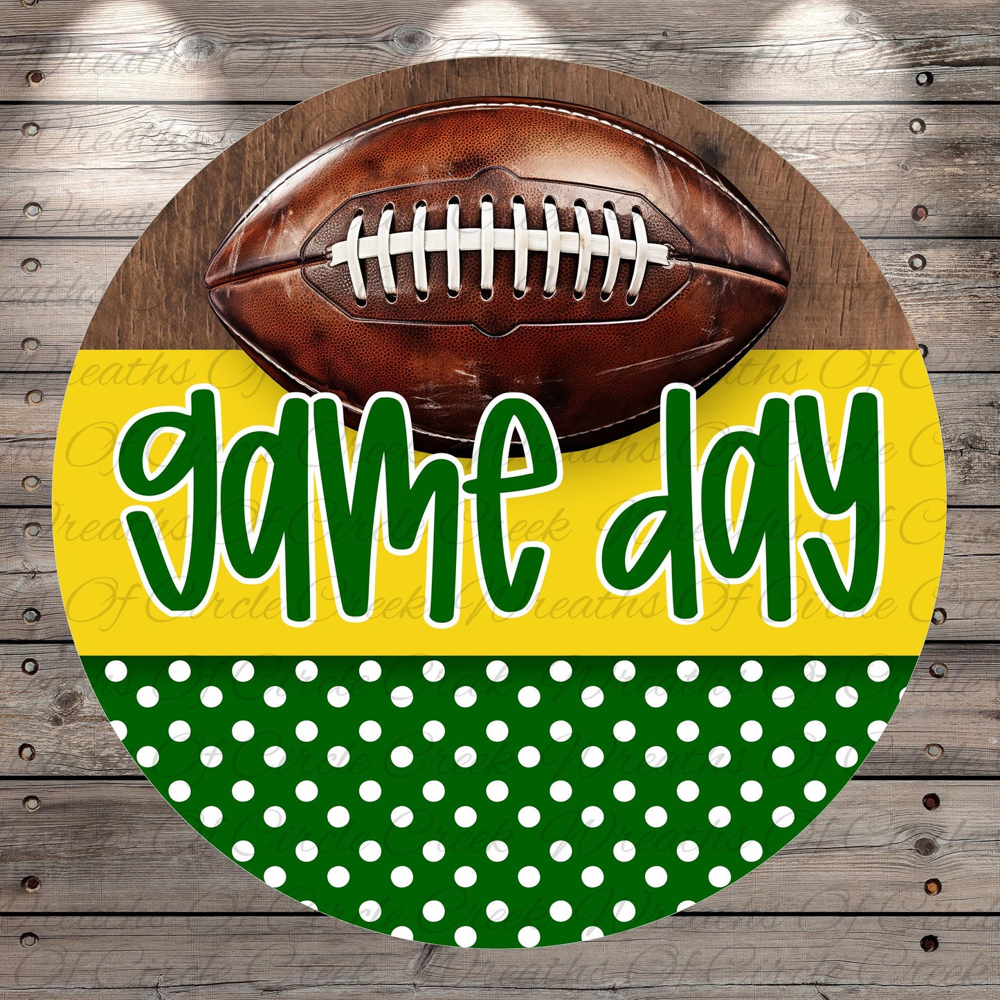 A football is displayed on a wooden background with the text "game day" written in green cursive font.