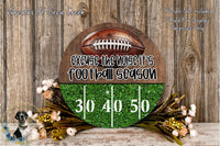 a football-themed decoration with a football and a text overlay that says "Excise the Noise it's football season". The decoration is set against a wooden background with a floral arrangement.