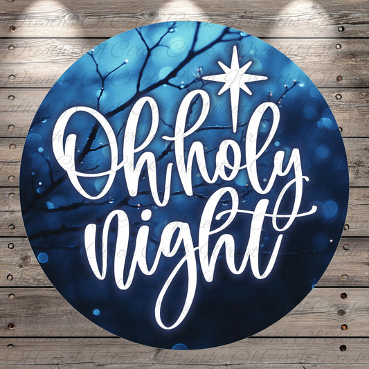 A circular graphic with the text "Oh holy night" written in a cursive font against a blue background with a star and branches.