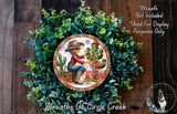a wreath with a cowboy-themed design, including a cowboy hat, boots, and a cactus. The wreath is surrounded by greenery, and there is a small image of a dog in the bottom right corner.