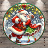 Santa Claus and a woman in a green dress are dancing together in a snowy winter scene, surrounded by festive decorations and twinkling lights.