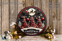 A festive Christmas wreath with a Santa Claus sleigh and a full moon, surrounded by red and black plaid trees, red and gold ornaments, and a "Merry Christmas" sign. The wreath is displayed on a wooden surface, with a bouquet of flowers and a small bird figurine in the foreground.