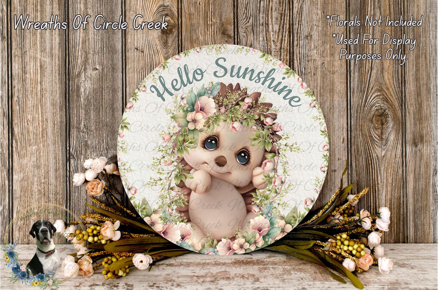 a picture of a baby hedge surrounded by flowers