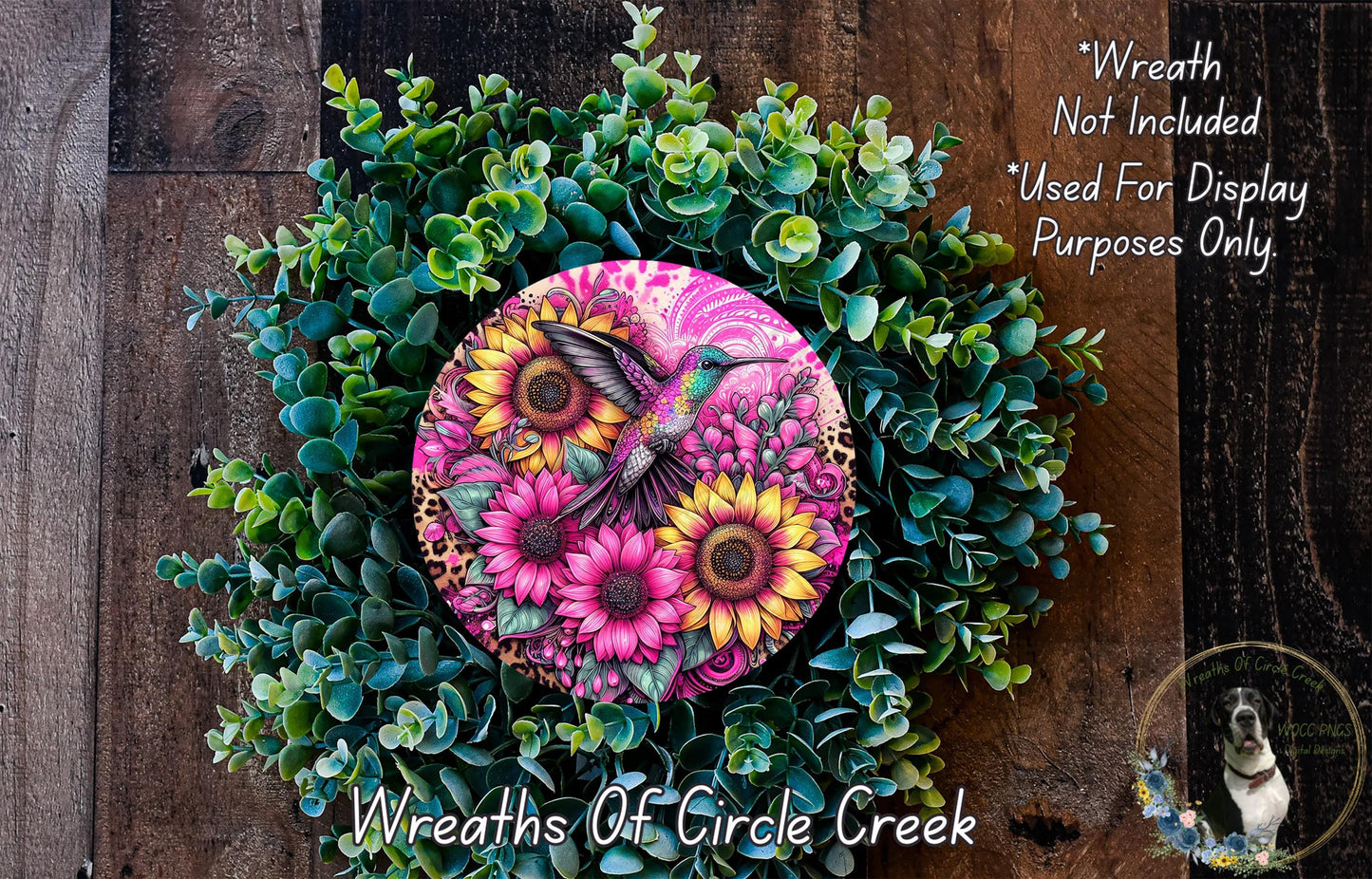 a wreath with flowers and a bird painted on it