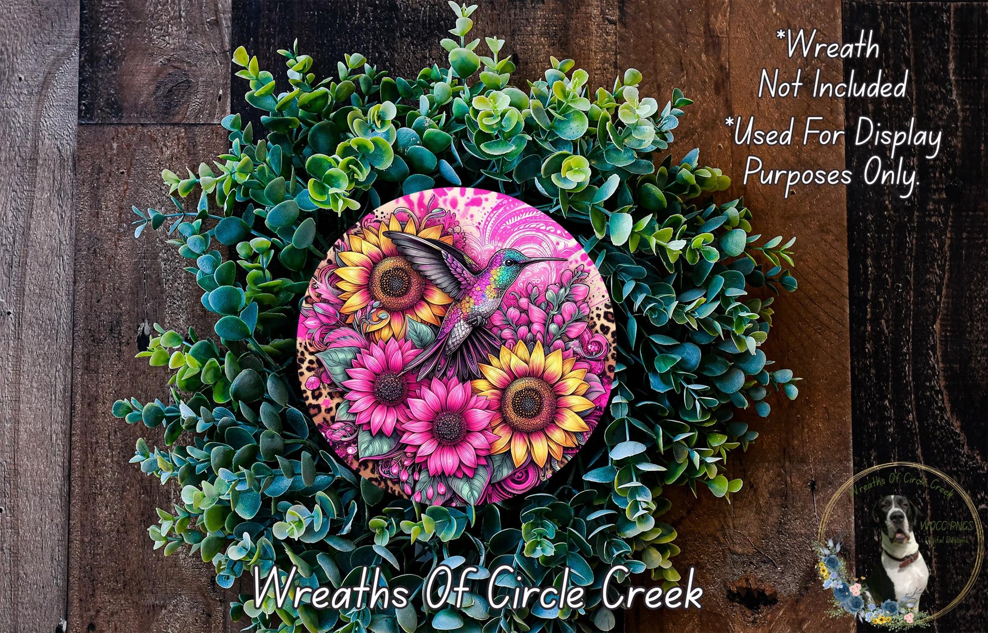a wreath with flowers and a bird painted on it