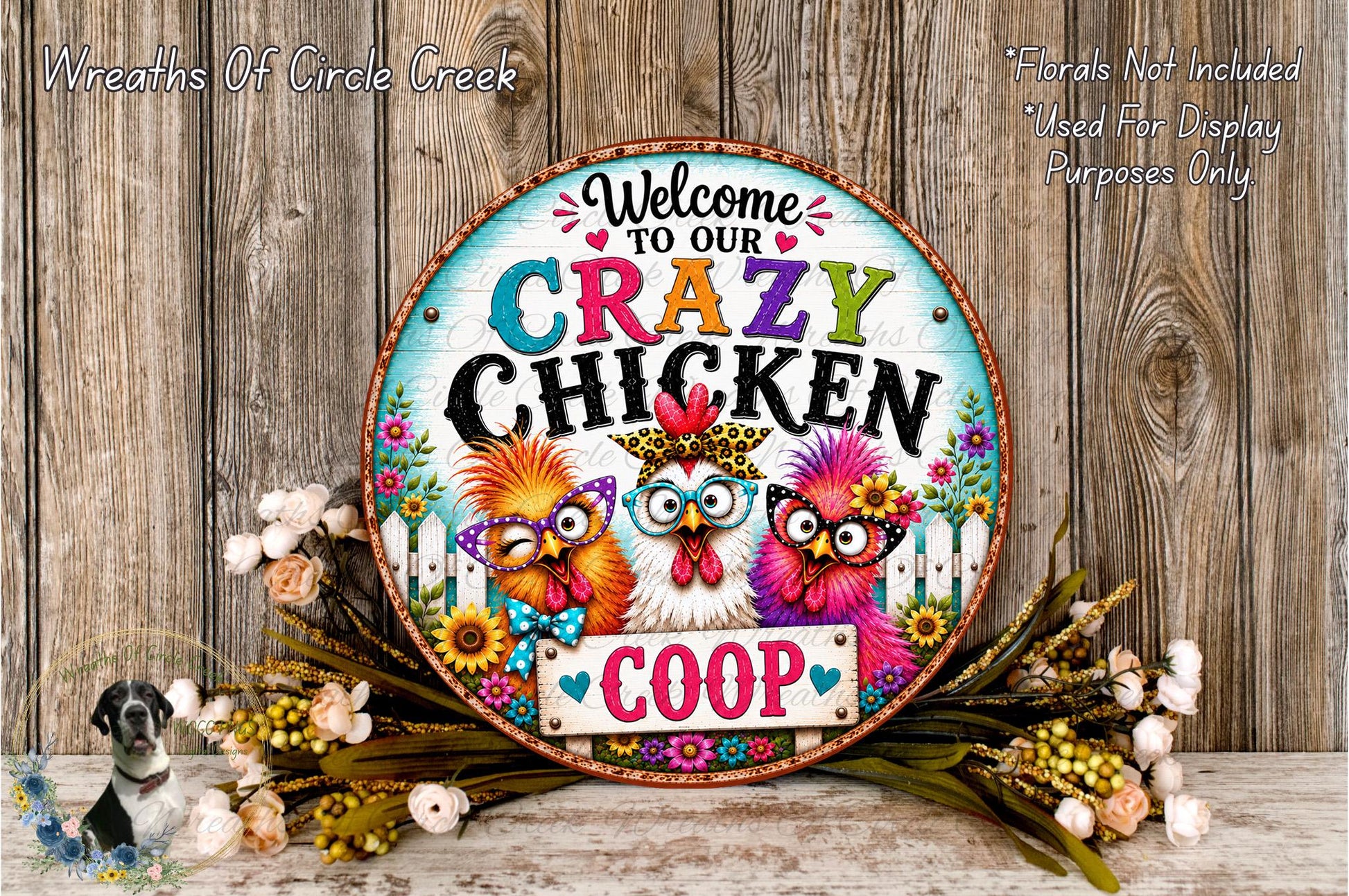 a colorful sign with the text "Welcome to our crazy chicken coop" surrounded by a floral arrangement and a wooden background.