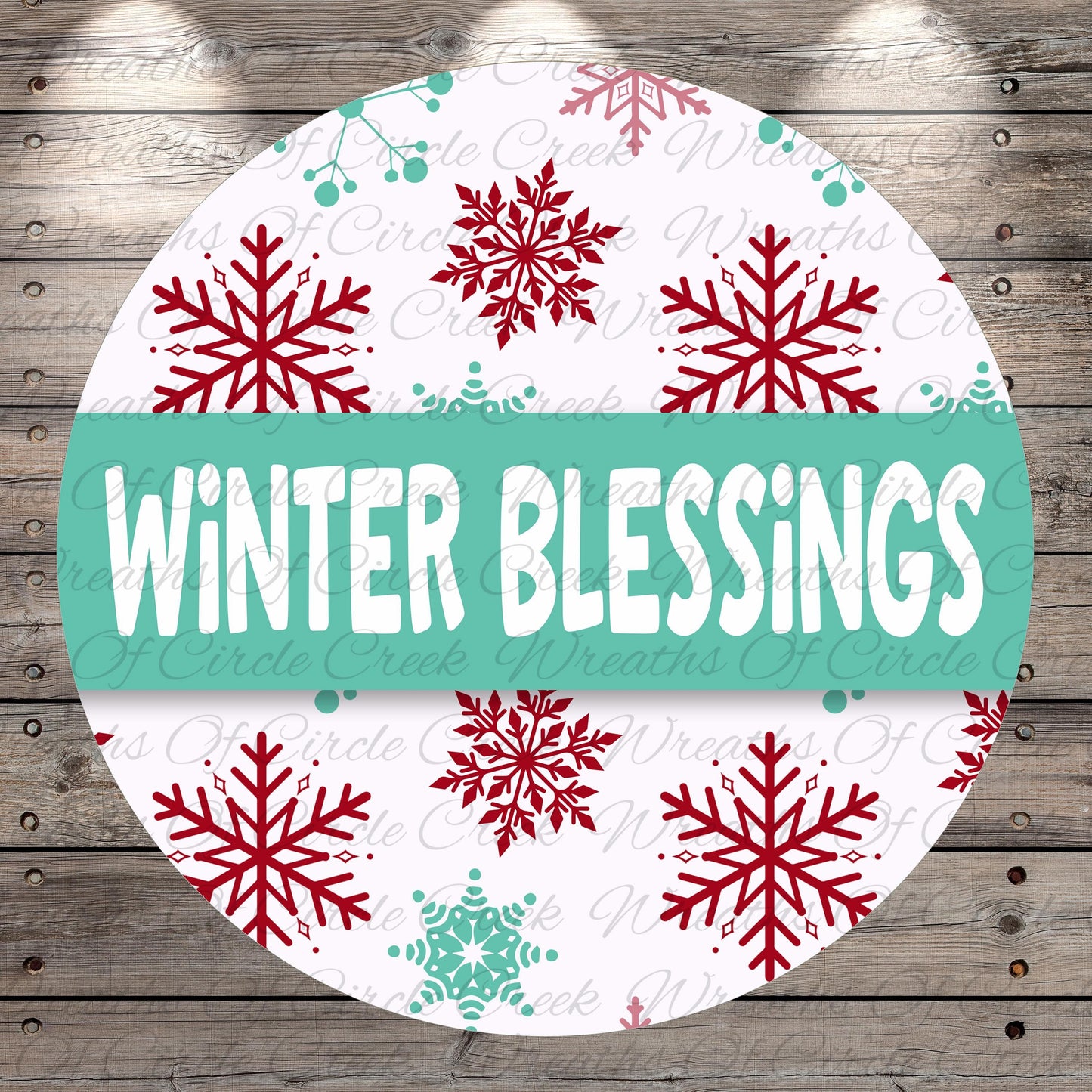 A circular sign with the text "Winter Blessings" in large white letters, surrounded by red and green snowflakes on a white background.