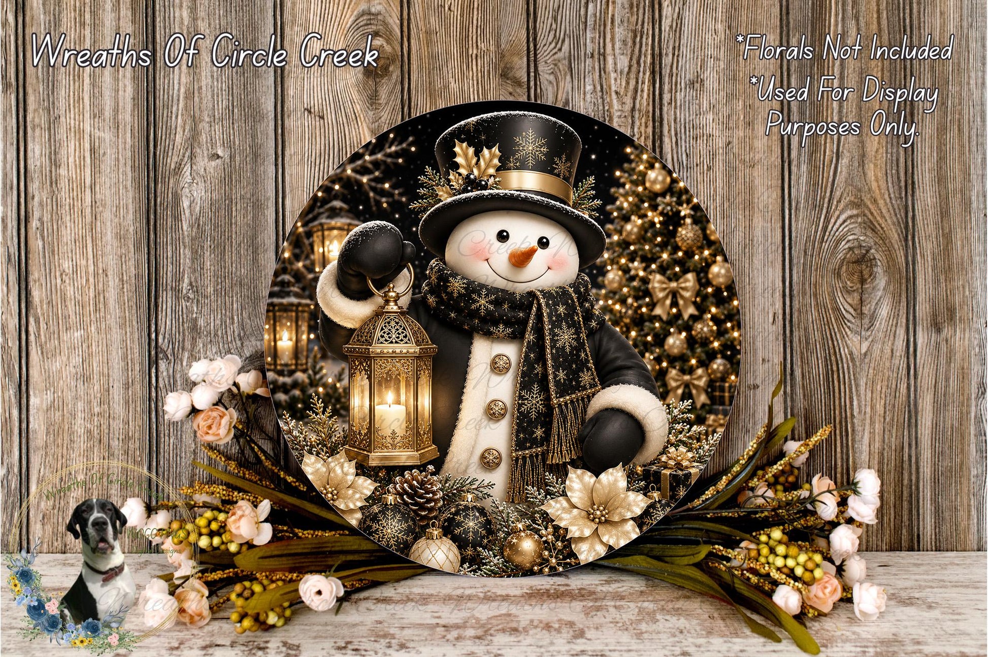 A snowman wearing a black top hat and scarf, holding a lantern, surrounded by a wreath of flowers and a Christmas tree, with a wooden background.