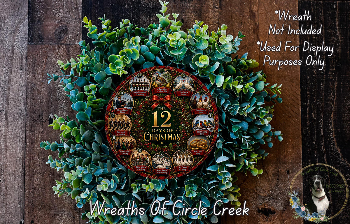 A wreath made of green leaves and a circular ornament with the text "12 DAYS OF CHRISTMAS" displayed on it, placed on a wooden surface.