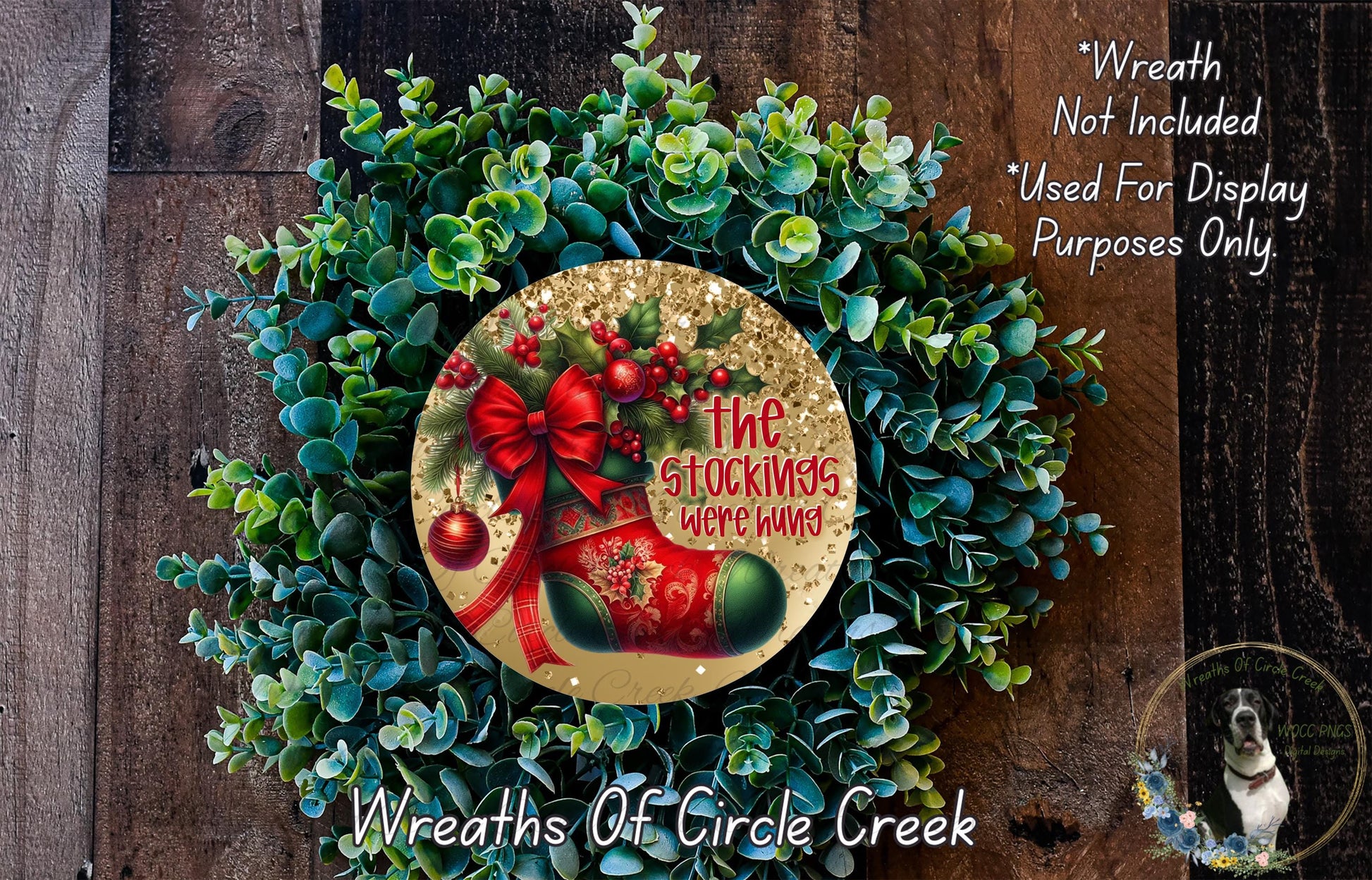 a Christmas wreath with a red bow and a green stocking cap, surrounded by a lush green wreath. The wreath is displayed on a wooden background.
