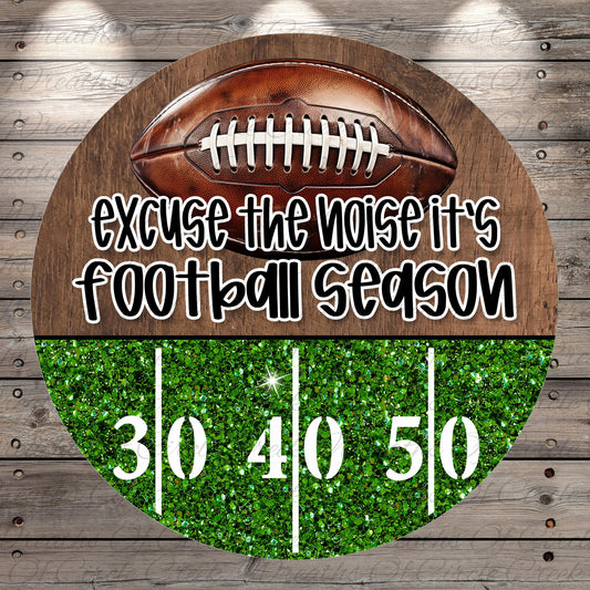 a football with the text "Excuse the noise it's football season" written on it, along with the numbers "30 40 50" displayed on a glittery green background.
