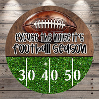 a football with the text "Excuse the noise it's football season" written on it, along with the numbers "30 40 50" displayed on a glittery green background.
