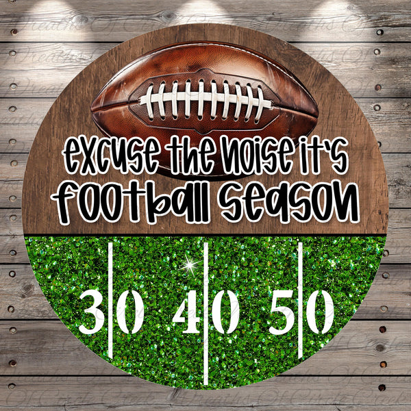 a football with the text "Excuse the noise it's football season" written on it, along with the numbers "30 40 50" displayed on a glittery green background.