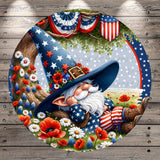 A whimsical illustration depicting a gnome wearing a wizard's hat and striped pants, surrounded by a field of flowers and patriotic American flags, with a tree in the background.