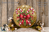 A festive Christmas wreath with candy canes, red and gold ribbons, and greenery, displayed on a wooden surface.