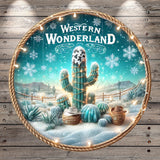 A decorative plate with a cactus surrounded by snow and twinkling lights, set against a snowy landscape with mountains in the background.