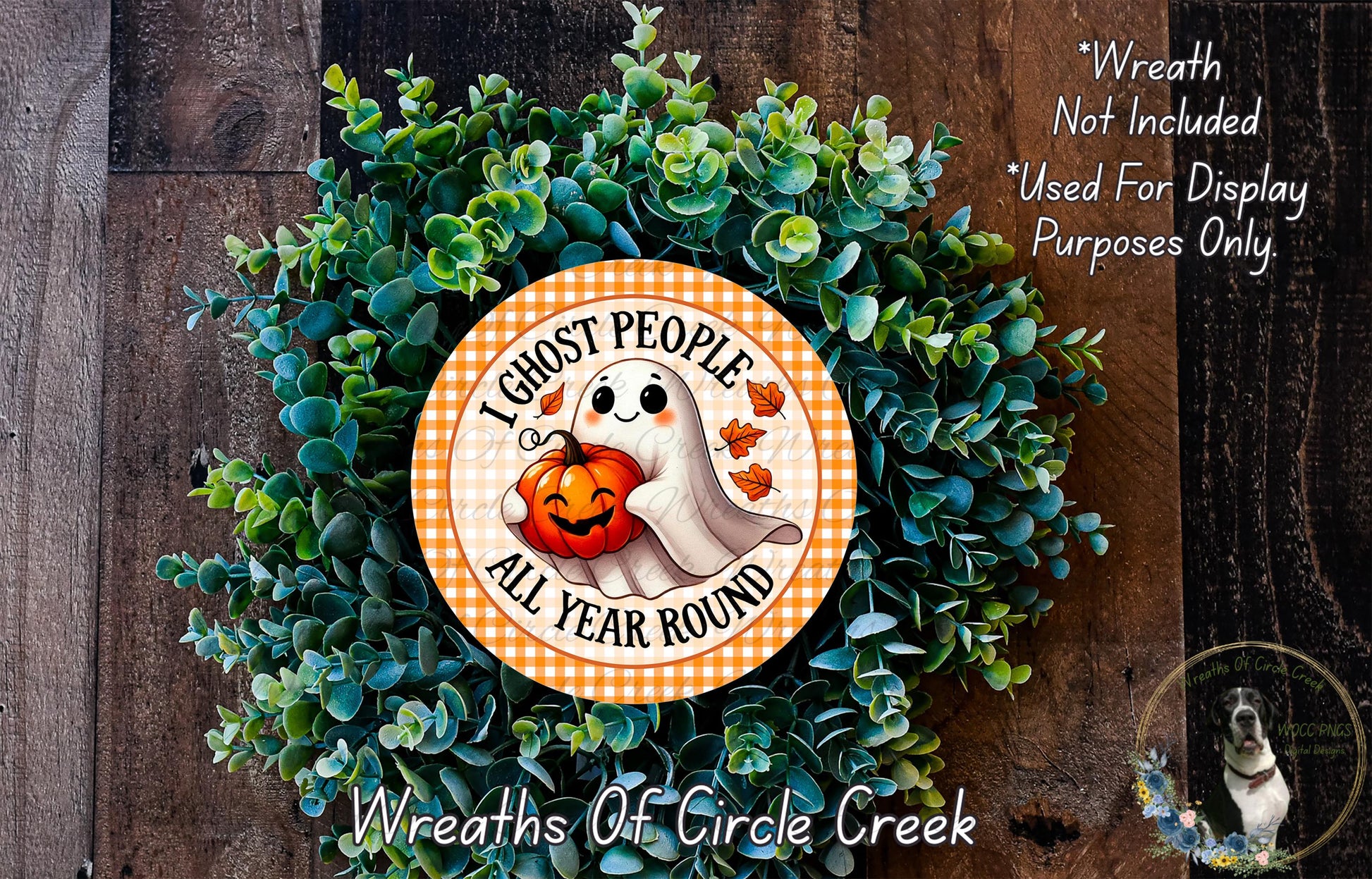 a Halloween-themed wreath made of green foliage and a ghost holding a pumpkin. The wreath is displayed on a wooden surface, and there is a text overlay that reads "I Ghost People All Year Round" and "Wreath Not Included * Used For Display Purposes Only".