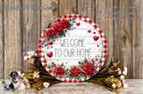 a round sign with a floral design, surrounded by a wreath of flowers and greenery, placed on a wooden surface.