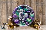A Halloween-themed wreath featuring a large, furry animal surrounded by pumpkins, roses, and bats against a dark background.