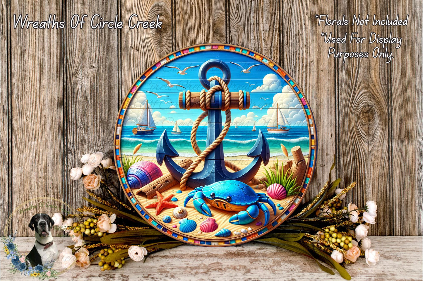 a round wooden plaque with a nautical scene, including a blue anchor, a crab, and a sailboat. The plaque is surrounded by a colorful arrangement of flowers and foliage, creating a vibrant and coastal atmosphere.
