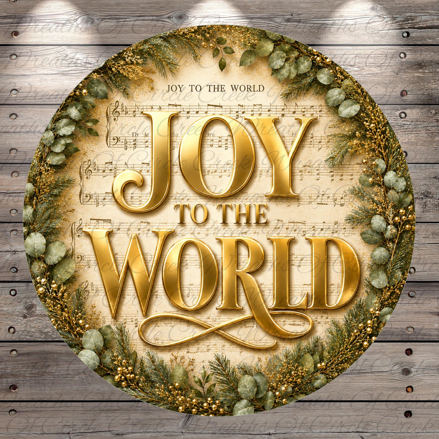 a circular design with the text "JOY TO THE WORLD" prominently displayed in the center. The design is surrounded by a wreath of greenery and other decorative elements, creating a festive and joyful atmosphere.