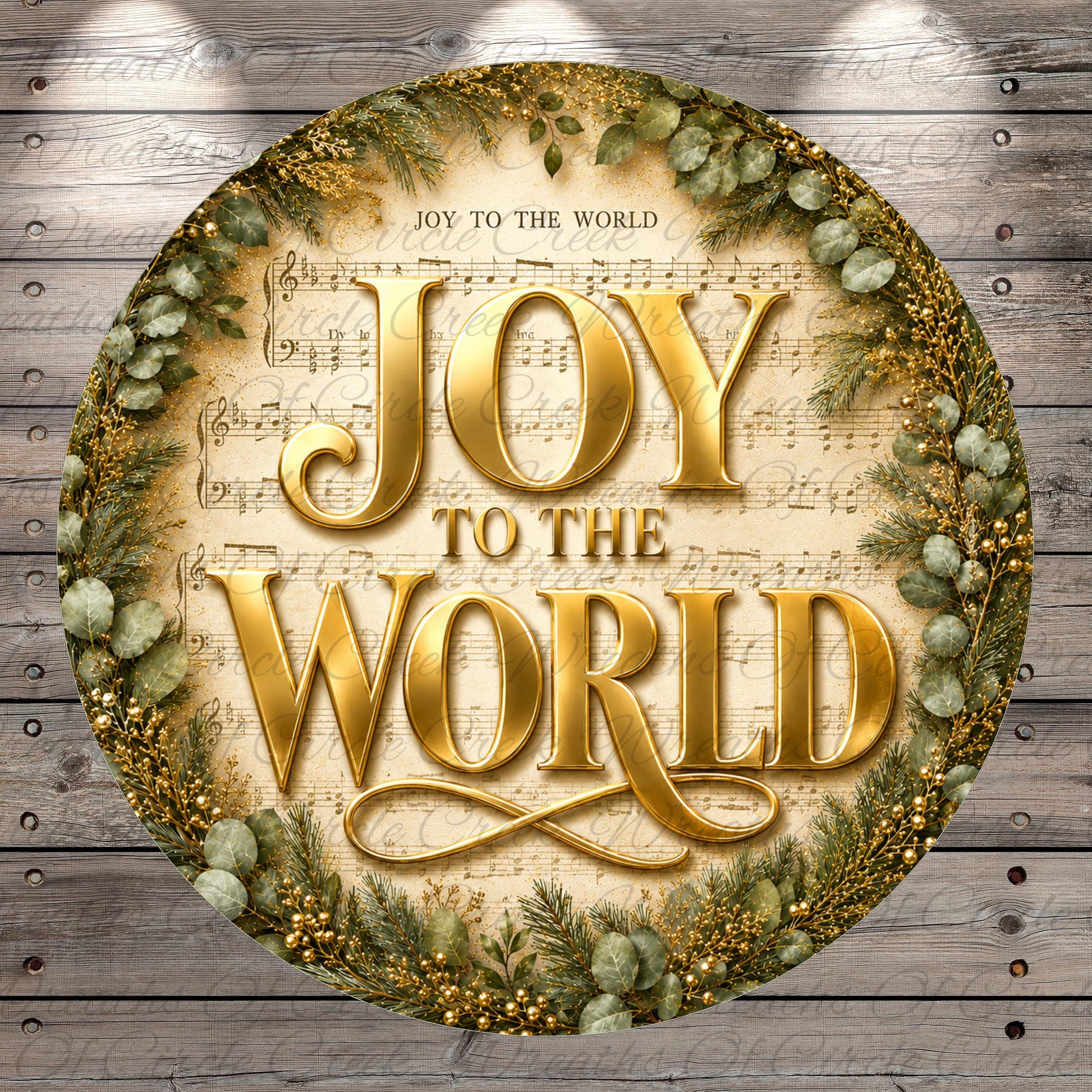 a circular design with the text "JOY TO THE WORLD" prominently displayed in the center. The design is surrounded by a wreath of greenery and other decorative elements, creating a festive and joyful atmosphere.
