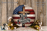 a round wooden sign with an American flag design and the text "God & Country" written on it. The sign is surrounded by a floral arrangement and placed on a wooden surface.