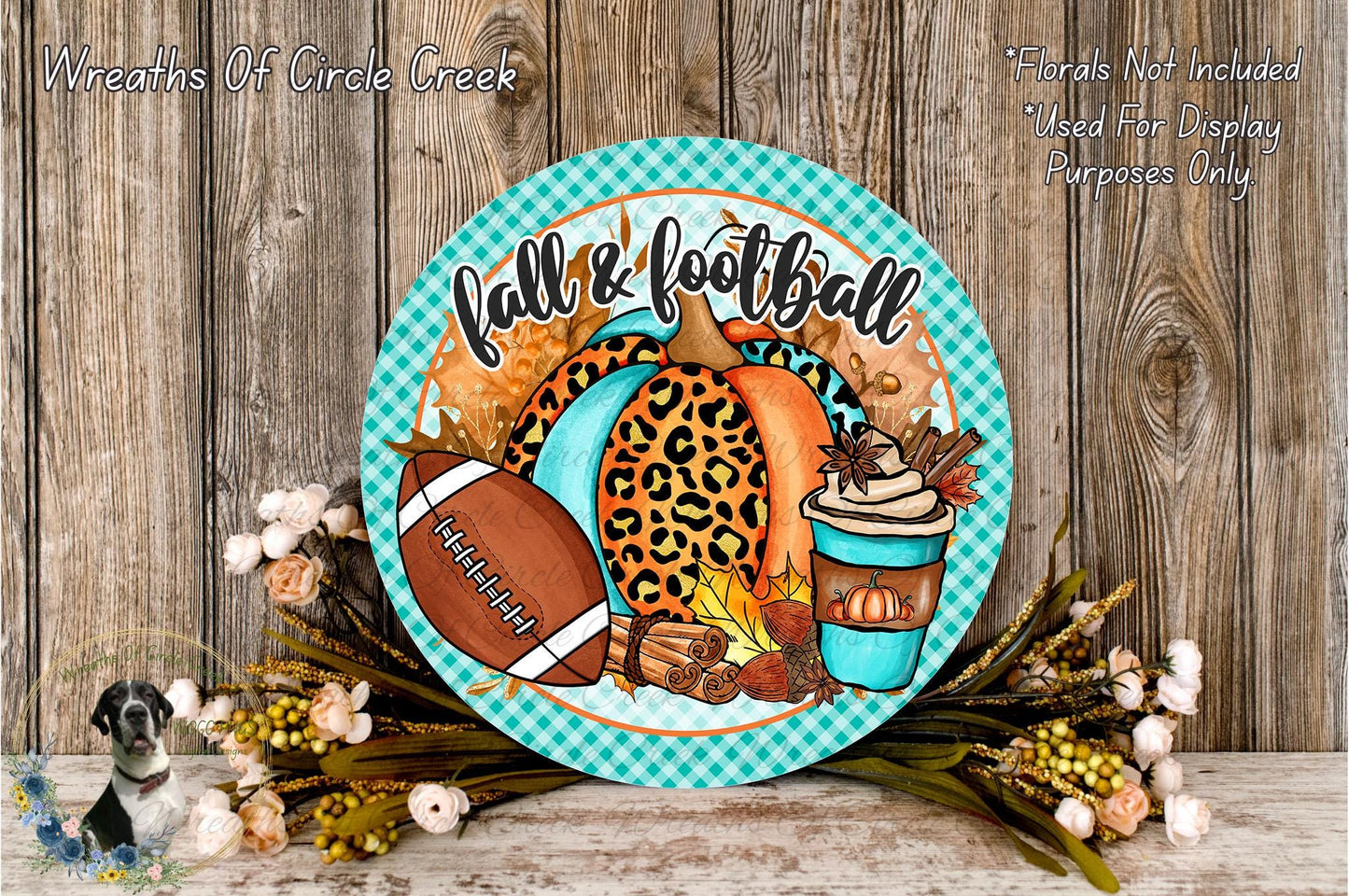 a decorative plate with a football, leopard print pumpkin, and fall-themed items, such as a cup of coffee and flowers, placed on a wooden surface.