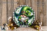 A decorative plate featuring a gnome wearing a green hat and holding a four-leaf clover, surrounded by flowers and a wooden background.