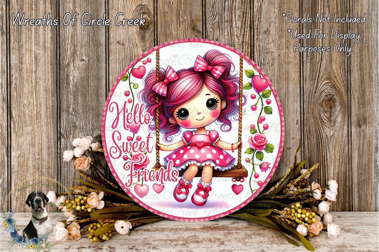 A round, decorative sign featuring a young girl with pink hair and bows, sitting on a swing surrounded by flowers and greenery.