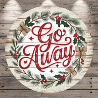 A circular wooden sign with the text "Go Away" surrounded by a wreath of pine branches, berries, and holly leaves.
