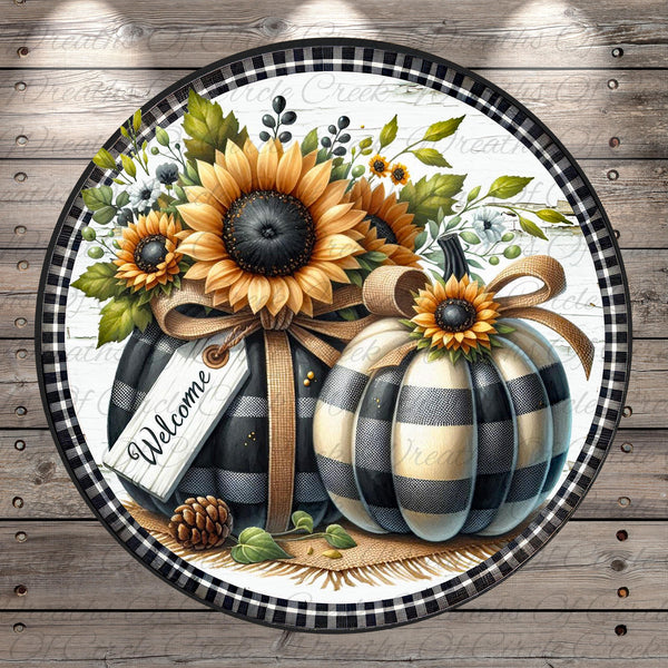 A decorative plate featuring a black and white striped pumpkin with a sunflower, a pine cone, and a "Welcome" sign, all set against a rustic wooden background.