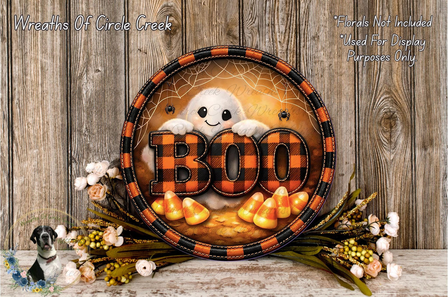 A Halloween-themed wreath with the word "BOO" in the center, surrounded by candy canes and flowers.