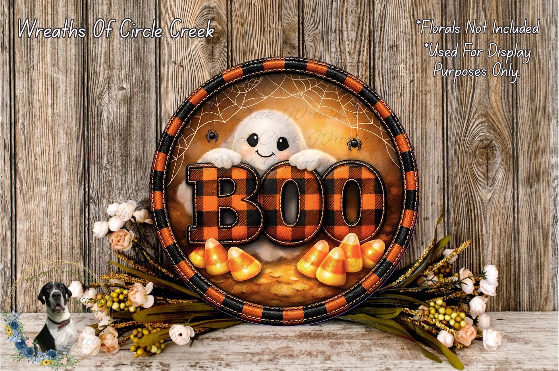 A Halloween-themed wreath with the word "BOO" in the center, surrounded by candy canes and flowers.