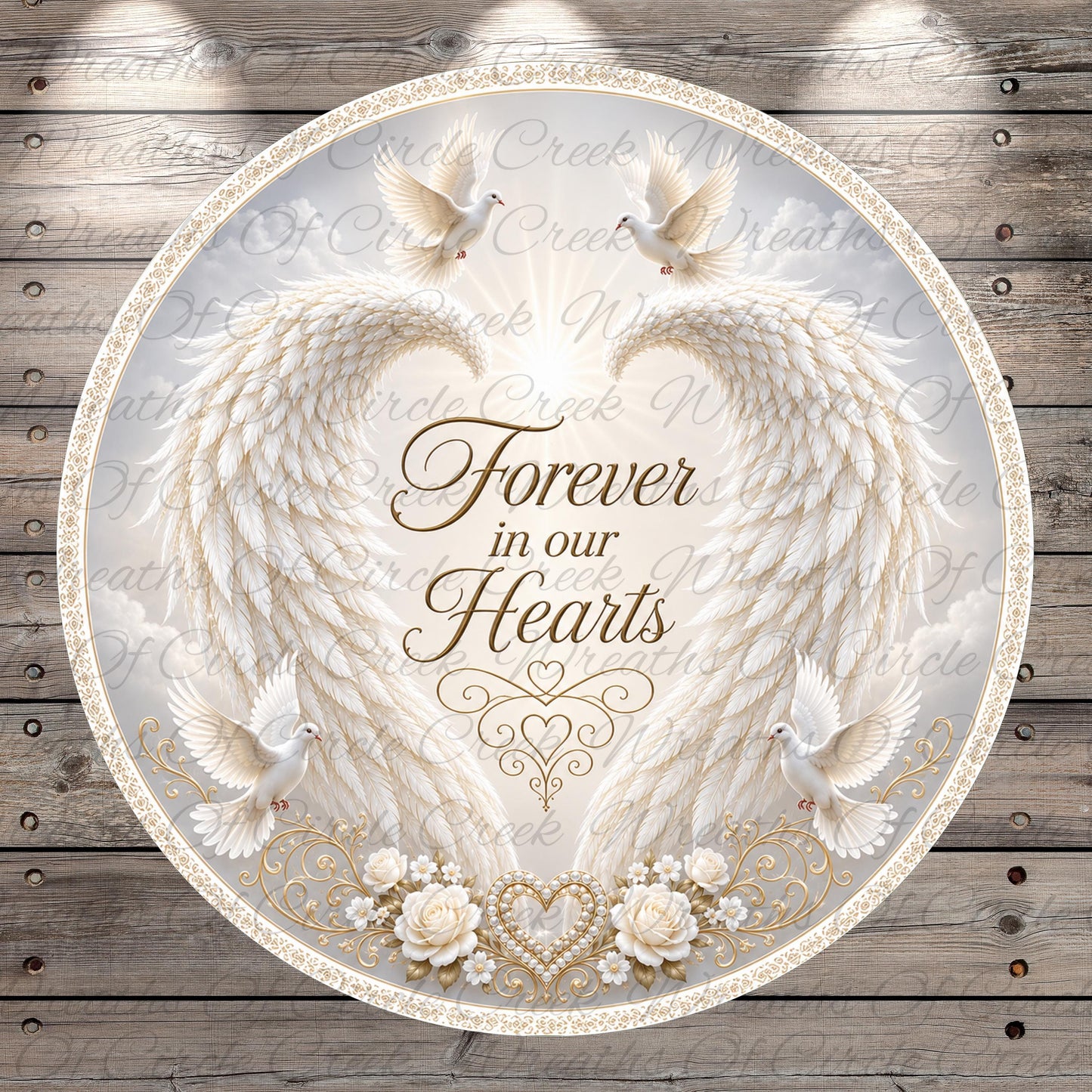 a circular design with a white background, adorned with a pair of angel wings, a heart, and a dove. The text "Forever in our hearts" is prominently displayed in the center of the design.