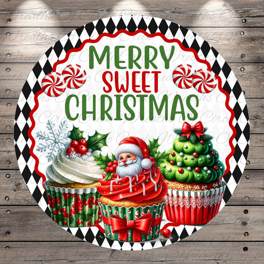 A festive Christmas-themed image featuring a Santa Claus figure surrounded by cupcakes decorated with red and green icing, candy canes, and holly leaves. The text "MERRY SWEET CHRISTMAS" is prominently displayed in the center of the image.