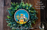 a wreath with a picture of a scarecrow on it