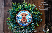 a wreath with a picture of a cow on it